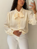 Cream button up shirt with a tie size XL