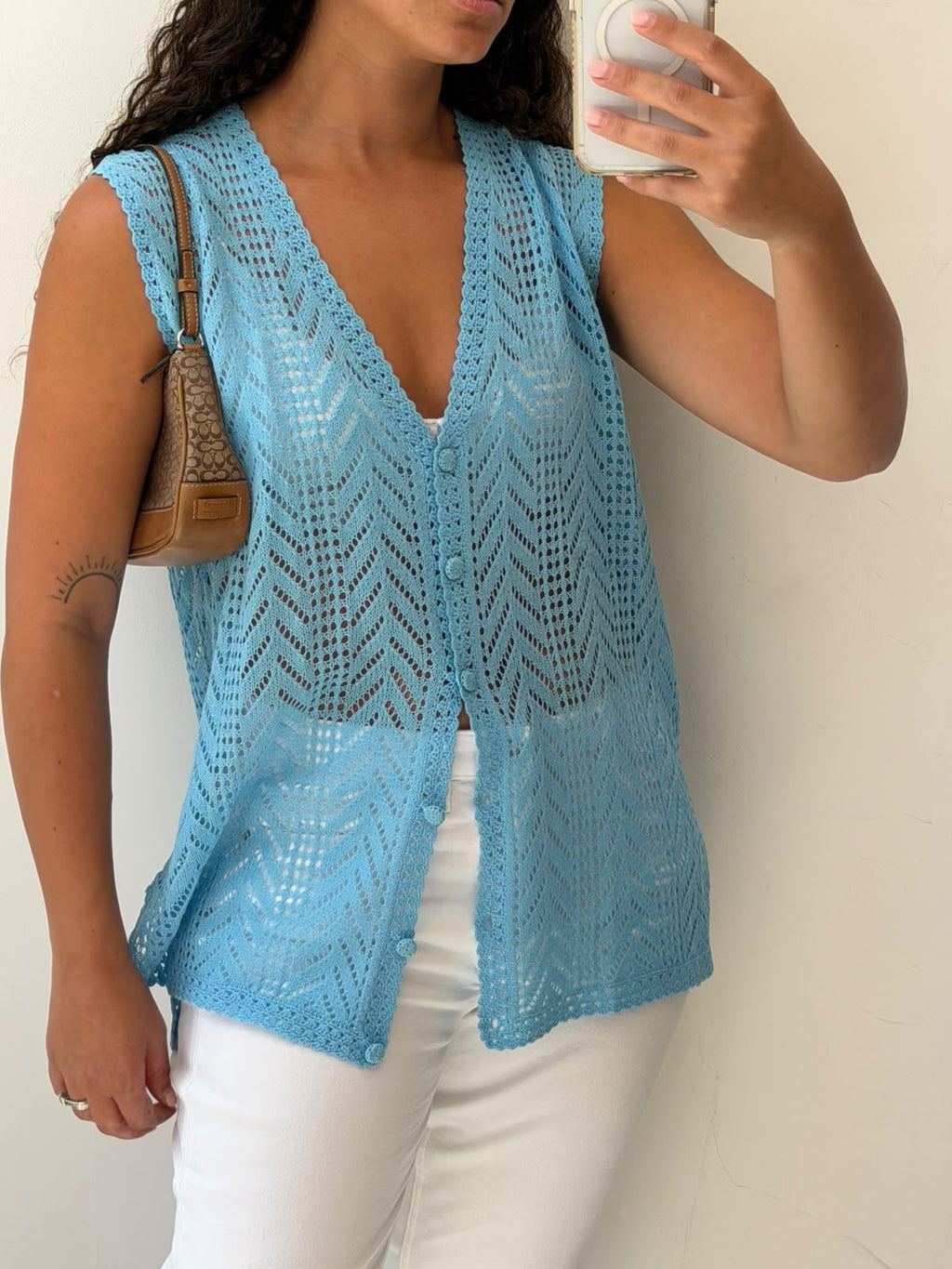 Knitted light blue vest size L